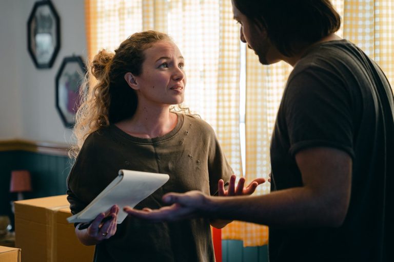 a man and a woman learning English for the moving process