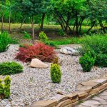 Combining flagstone with decorative boulders adds natural beauty and strength to structural and landscape projects.